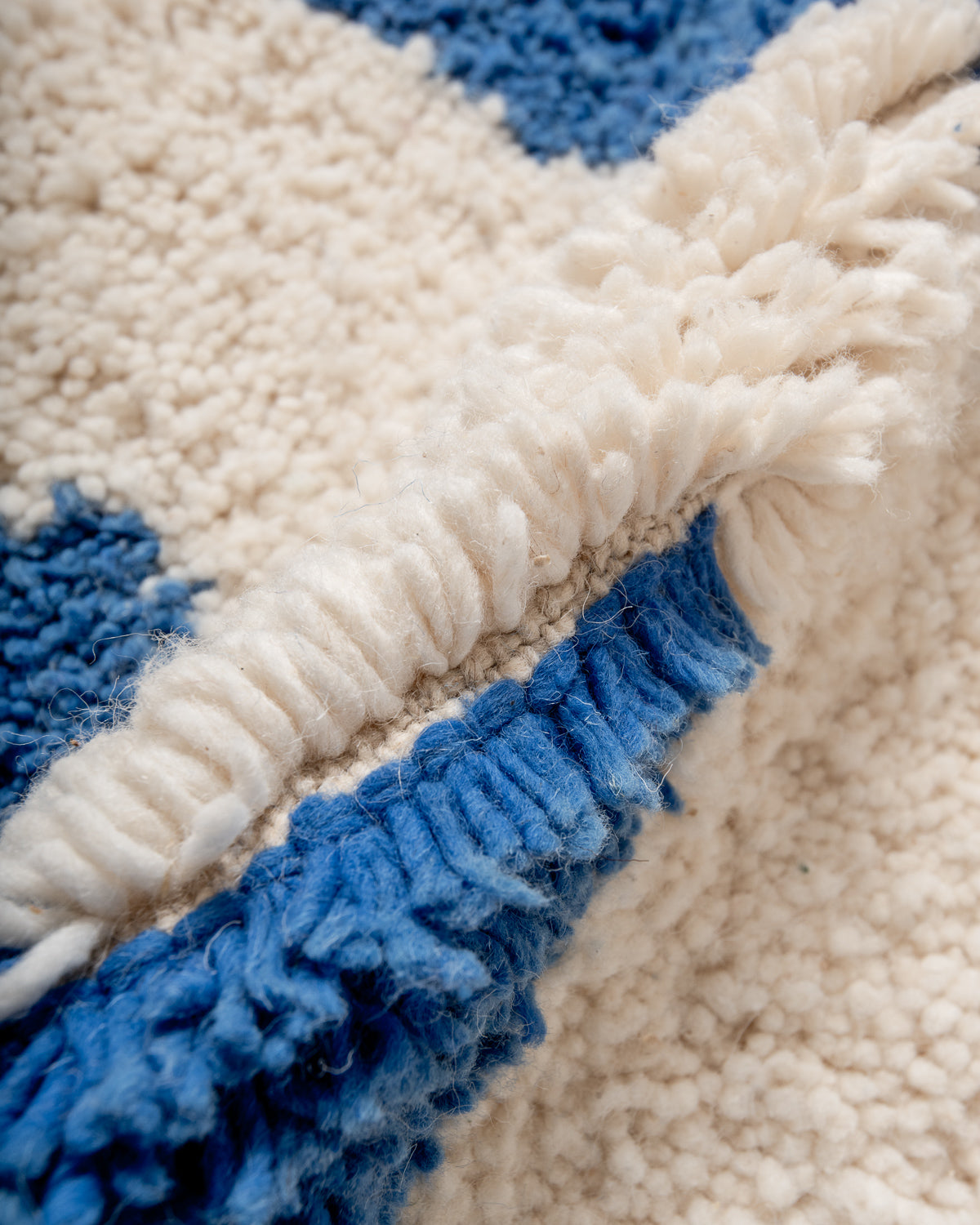 Modern, designer, handcrafted Berber rug from Morocco. Beniourain carpet with beautiful colours and patterns and fluffy wool texture.